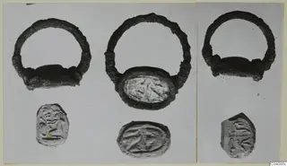 Three silver rings with oval bezels, each with a seal impression photographed below it.