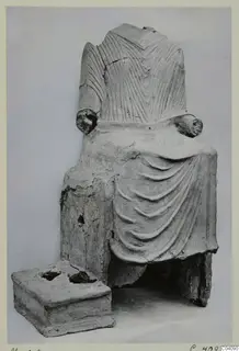 Seated headless figure with a draped garment and incised upper body, a find from Marion