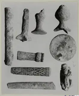 Group of worked stone objects from Arsos, including a cylinder with a diagonal incised pattern