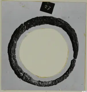 Corroded ring-shaped object with a black number label, from Ayios Iakovos Tomb 14