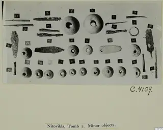 Small finds from Nitovikla T.I: pins, tools, a ring and rounded perforated objects laid out in rows