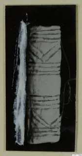 Worked bone object with incised horizontal lines and chevron patterns, from Amathus tomb 2-26
