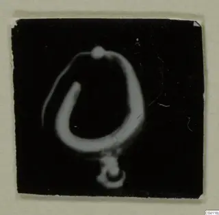 Gold hoop earring with a small pendant, from Amathus, shown as a negative image