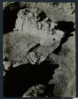 Excavated stone structure at Soli, Cholades Temples A-B, with a stepped earth surface in front of it.