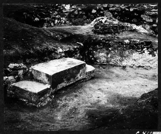 Excavated stone steps and a large squared stone block at Soli, Cholades Temples A-B, with rubble walls behind.