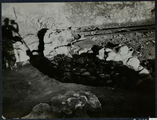 Excavation at Cholades, Soli, showing a stone wall beside a rail track