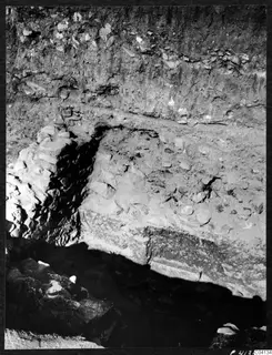 Excavated stone walls and packed soil at the Cholades Temples A-B at Soli, seen from a trench.