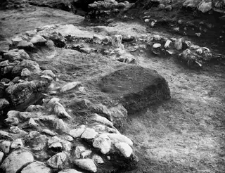 Excavated room at Cholades with a rectangular offering pit beside low stone walls