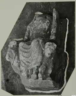 Stone sculpture of a seated figure in a draped garment, from Soli