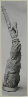Marble sculpture from Soli: a carved hand grips a tall banded shaft above a textured, draped base.