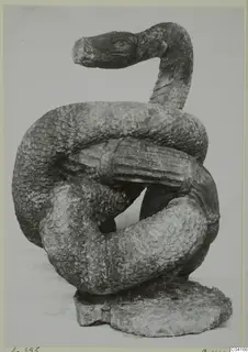 Stone sculpture of a coiled snake with raised head, from Soli