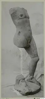 Stone statue from Soli: a nude standing torso, head and arms missing, on a rough base
