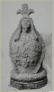 Stone statue from Soli: a bearded head with long hair and a fan-shaped crest above a rounded body