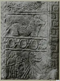Carved stone relief slab from Soli with an animal in profile above a row of rings and a figure below