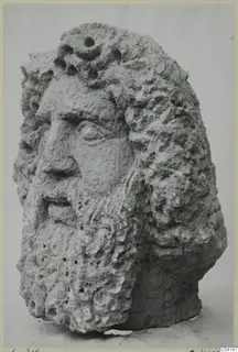 Carved stone head of a bearded man with curly hair, from Soli