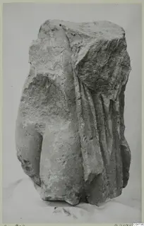 Stone sculpture fragment from Soli, a draped figure's torso with broken upper part.