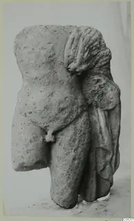 Limestone torso fragment from Mersinaki, with drapery falling over one side