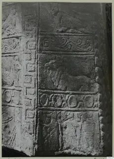 Carved stone relief from Soli showing horizontal bands of scroll, animal and figure motifs