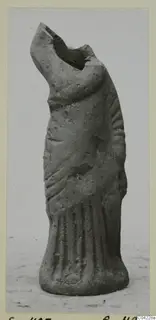 Headless terracotta figurine fragment from Soli with a flared, vertically folded lower body