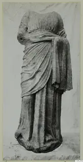 Headless draped stone statue of a standing figure, from Soli.