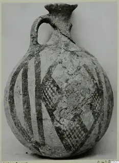 Pottery White Painted IV-V jug from Milia, round body with dark painted bands and checkered panels