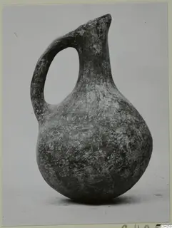 One-handled jug of Black Slip Ware with a pinched spout, from Milia