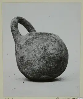 Pottery Monochrome Ware vessel with a single loop handle, from Milia