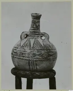 White Painted IV-V pottery vessel from Milia with two loop handles and painted bands and hatched triangles