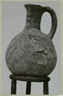 White Painted IV-V jug from Milia with a single loop handle and diagonal painted bands