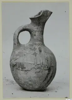 White Painted jug from Milia with a loop handle and pinched spout