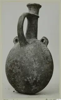 Pottery Base-Ring Ware vessel from Milia with a trumpet neck, strap handle and two pierced lugs