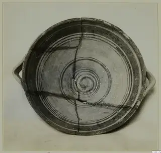 Pottery bowl-jar with two horizontal handles, from Enkomi, seen from above with concentric bands and a central spiral.