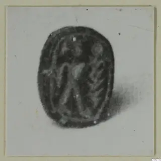 Scarab-shaped seal or gem from Amathus, photographed face on with an engraved pattern