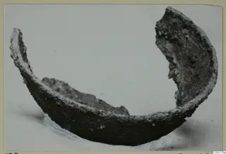 Fragment of a bowl from Amathus, dark and encrusted, with broken rims