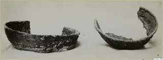 Two fragmentary bowls, encrusted with pale deposits, photographed side by side; from Amathus