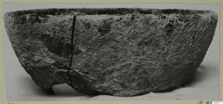 Bowl from Amathus with a rough, pitted surface and a vertical crack, seen from the side
