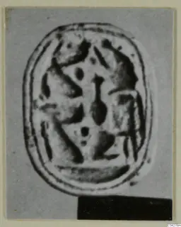 Oval engraved object from Amathus, shown as an enlarged photograph on a grey mount
