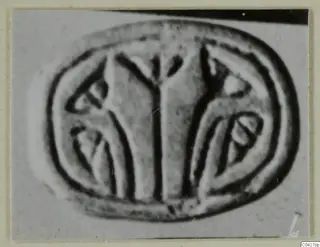 Glyptic from Amathus: an oval engraved face with a central forked motif flanked by curved shapes