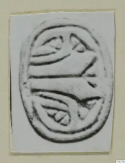 Glyptic from Amathus: an engraved oval seal, photographed on a white card mount