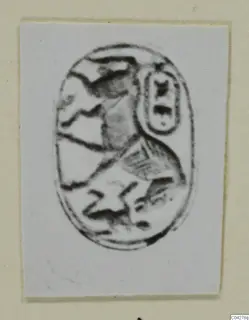 Oval seal or scarab from Amathus with an incised design, photographed on a light card.