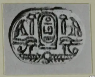 Oval engraved seal from Amathus with a central oval panel of signs flanked by smaller motifs