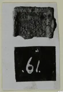 Photo mount with two views: a pitted, corroded fragment above a dark number label, Amathus tombs 1–9 series