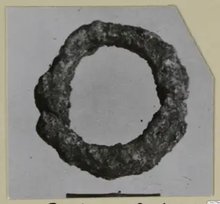 Corroded bronze ring, a loop of metal with a rough dark surface, from Amathus