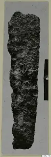Corroded iron tool from Amathus, shown upright beside a scale bar.