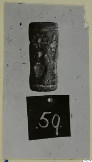 Cylinder seal from Amathus, shown upright on a grey mount above a number label.
