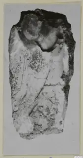 Weathered elongated fragment from Amathus with a rounded upper end and broken, crusted edges, shown on a grey ground