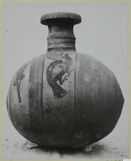 Round-bodied painted jug with a flat-topped neck, banded vertical stripes and a black bird motif on its shoulder.