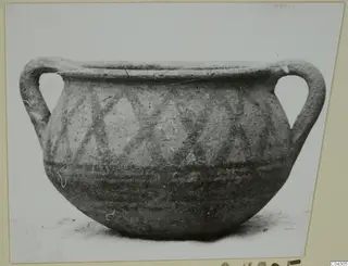 Two-handled painted pottery vessel from Idalion, with crossing diagonal bands on the upper body