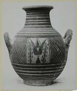 Two-handled painted pottery jar with banded neck, lattice panels and a central motif on the body.