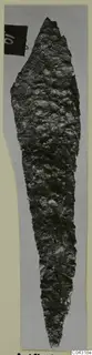 Corroded iron weapon blade with a pointed tip, photographed on grey card, from Amathus.